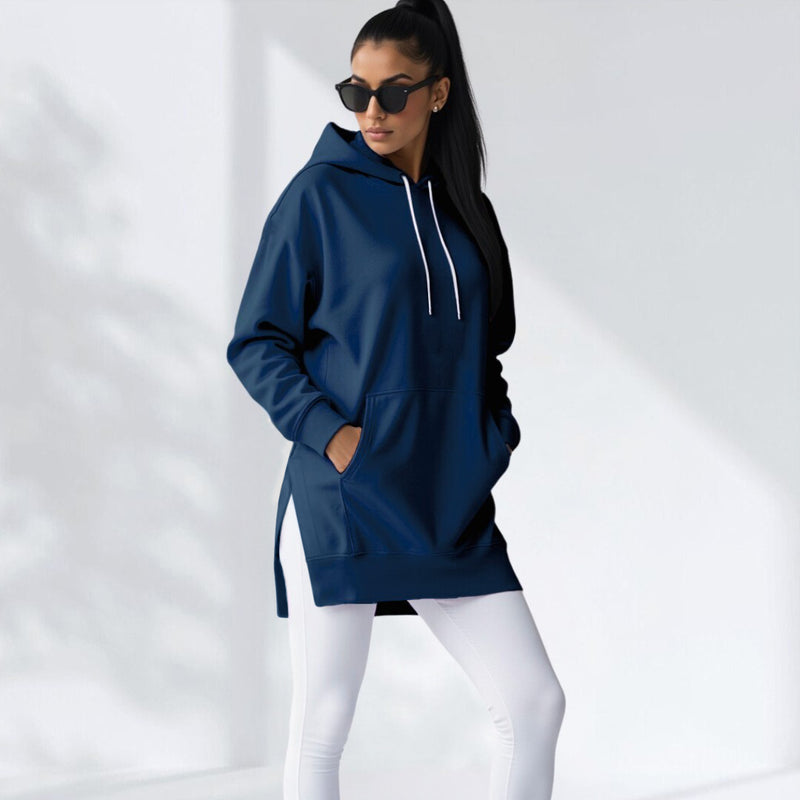 Woman wearing a navy blue  hoodie dress, standing and facing forward to show the fit and style.