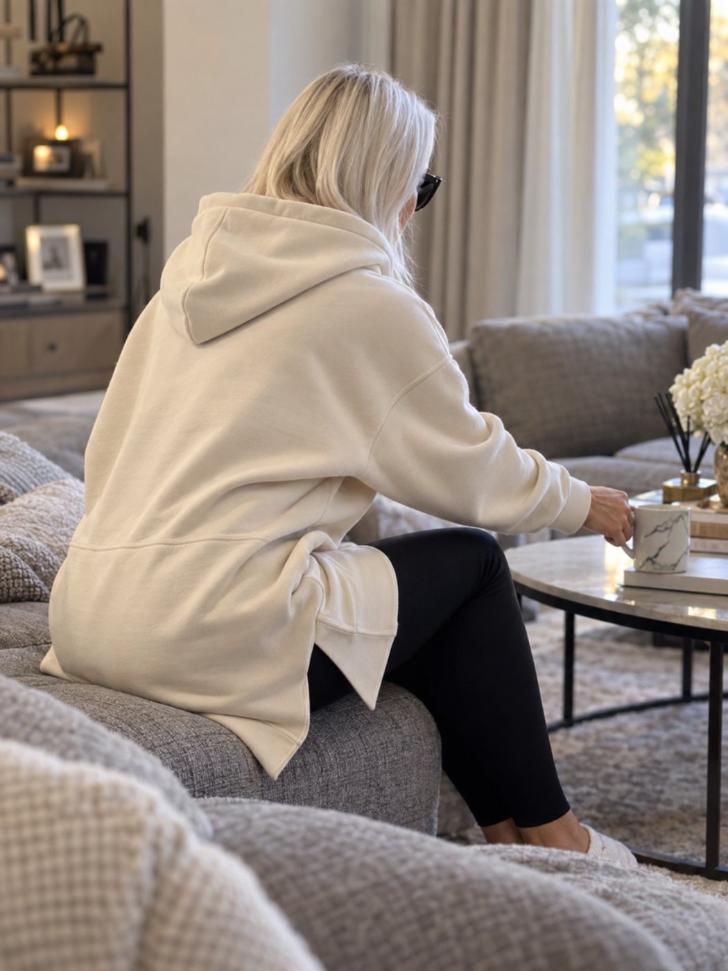 Warmy hoodie dress covering the thighs while seated